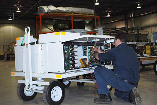 Patlon technician performing repair and overhaul services on ground support equipment in Patlon facility