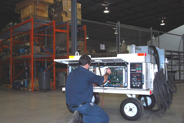 Patlon technician performing repair and overhaul services on ground support equipment in Patlon facility.